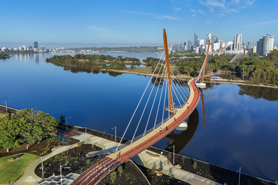 Aerial view of Boorloo Bridge crossing the Swan River in Perth, Western Australia, highlighting modern local architecture.