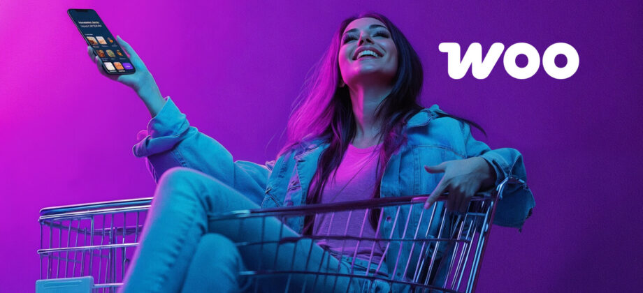 Woman holding a smartphone while sitting in a shopping cart with WooCommerce branding, symbolising online shopping and e-commerce growth in Perth.